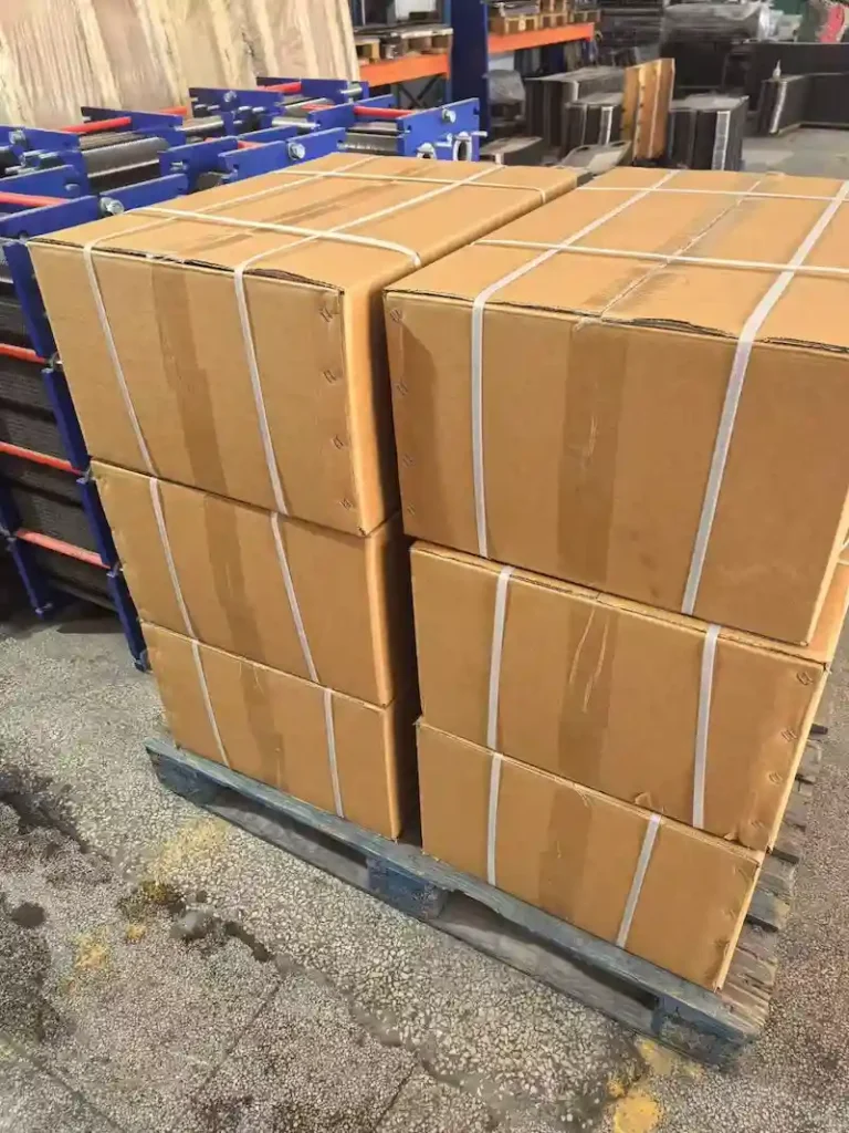 Industrial packaging of bulk PHE gasket orders for international shipping by Senovis.
